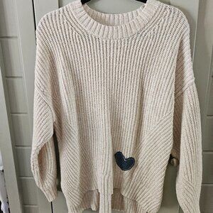 Elegant Beige Sweater with Heart Accent